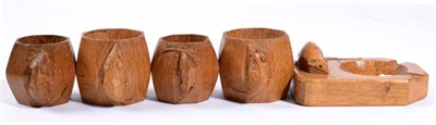 Lot 329A - Mouseman: Four Robert Thompson English Oak Napkin Rings, of octagonal form, each with carved...