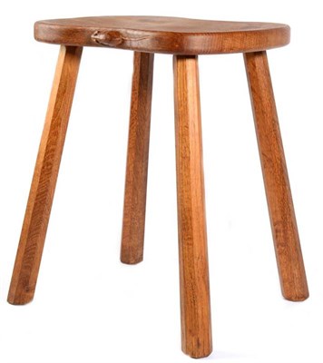 Lot 332 - Mouseman: A Robert Thompson English Oak Cow Stool, shaped seat on four octagonal legs, with...