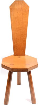 Lot 341 - Mouseman: A Robert Thompson English Oak Spinning Chair, with shaped back, heptagonal seat, on three