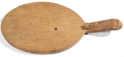 Lot 347 - Mouseman: A Robert Thompson English Oak Cheese Board, with carved mouse signature on handle, 37cm