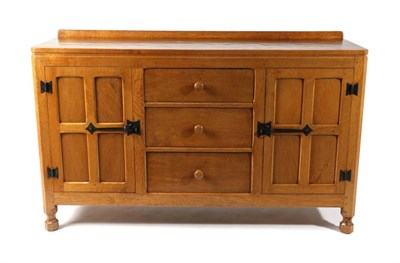 Lot 379 - Squirrelman: A Wilfrid Hutchinson (Husthwaite) English Oak 4'6'' Sideboard, with raised...