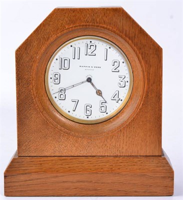 Lot 387 - A Yorkshire School Oak Mantel Timepiece, the shaped square case on a rectangular base, the movement