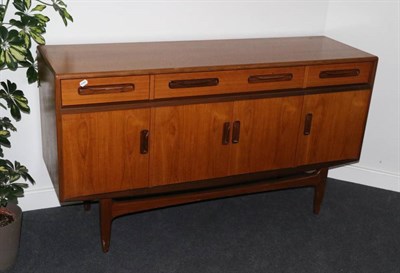 Lot 398 - A 1970s G-Plan Teak Dining Suite, comprising an extending rectangular dining table on tapering...
