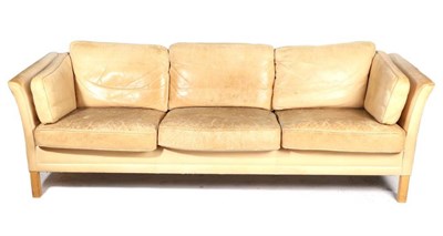 Lot 408 - A Danish Leather Two-Seater Sofa, with arched back and curved arms, on stained mahogany square form