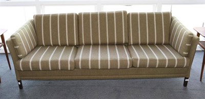 Lot 409 - A Three-Seater Danish Design Sofa, in original stripped khaki fabric, with eight cushions and plain