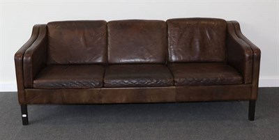Lot 410 - A 1970s Danish Design Three-Seater Brown Leather Sofa, in the manner of Borge Mogensen, with...