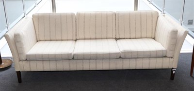 Lot 413 - A 1970s Danish Three-Seater Sofa, with original cream wool upholstery, on square tapering legs,...