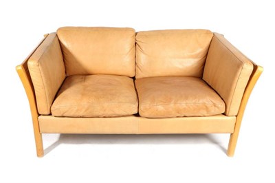 Lot 415 - Stouby: A Light Brown Tan Leather Two-Seater Sofa, with beech frame, 146cm by 80cm by 65cm