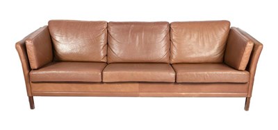 Lot 417 - A 1960s Danish Tan Leather Three-Seater London-Type Sofa, on beech legs, 210cm by 70cm by 66cm