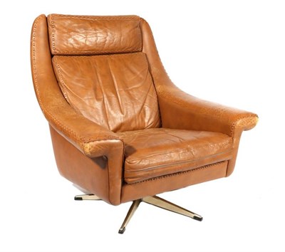 Lot 424 - A 1970s Swivel Armchair, designed by Aage Christinsen, upholstered in brown tan leather with...