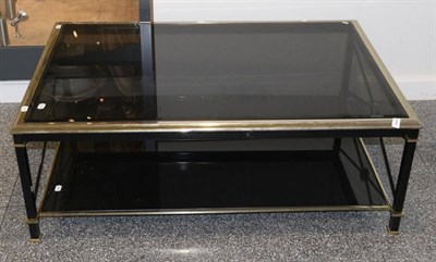 Lot 429 - A 1970s Brass and Tinted Glass Rectangular Two-Tier Coffee Table, with bevelled glass plates...