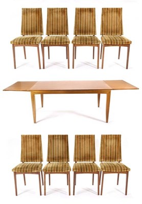 Lot 432 - A 1970s Walnut and Crossbanded Extending Dining Table, of rectangular form with pull-out leaves...