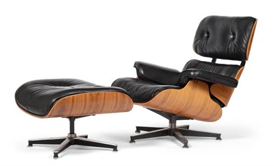 Lot 441 - Charles and Ray Eames: A Cherry 670 Lounge Chair and 671 Ottoman, modern, with black leather padded