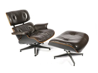 Lot 444 - Charles and Ray Eames: A Brown Leather and Ebonised 671 Lounge Chair and Matching 670 Ottoman,...