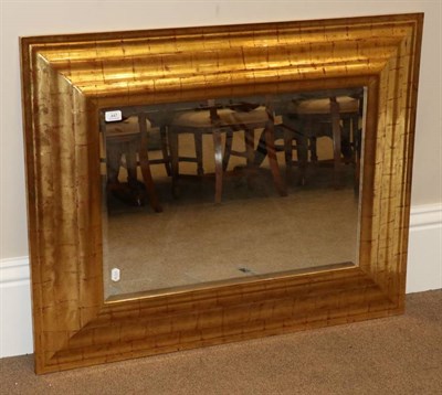 Lot 447 - A Gilded and Red Painted Mirror, modern, with rectangular bevelled glass plate, 108cm by 83cm