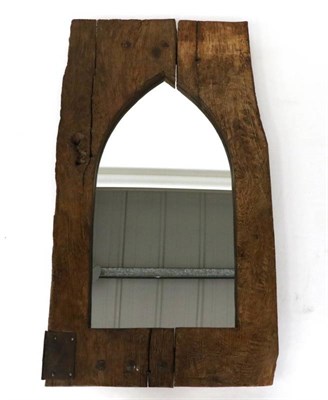 Lot 448 - A Gothic Style Oak Mirror, with plain arched mirror plate, the verso labelled Antique Timber Mirror