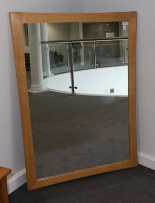 Lot 462 - An Ercol Light Oak Wall Mirror, with plain mirror plate, 129cm by 90cm