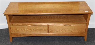 Lot 466 - An Ercol Light Ash Television Unit, modern, the base with two drawers, 132cm by 44cm