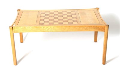 Lot 469 - A Light Elm and Ash Chess Top Coffee Table, labelled Ercol Galleries, circa 1980, of...