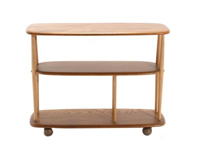 Lot 470 - An Ercol Originals Style Elm Three Tier Trolley, with beech spindle supports, 91cm by 32cm by 72cm