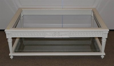 Lot 479 - make up to reserve- A Cream Painted Coffee Table, on carved and tapering legs joined by a...