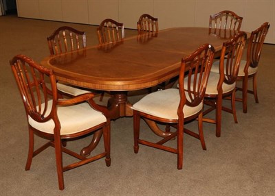 Lot 483A - A Walnut and Crossbanded Twin-Pedestal Dining Table, modern, of D shape form with one...