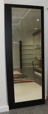 Lot 491 - A Black Ash Free-Standing Mirror, modern, with plain rectangular mirror plate, 199cm by 74cm