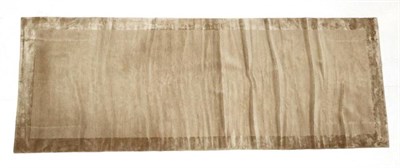 Lot 499 - A Modern Parkwood Gallery Carpet, hand-knotted, the plain beige field enclosed by similar...