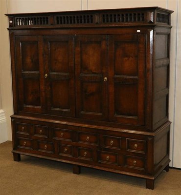 Lot 532 - A Bespoke Oak Television Cabinet, modern, in the form of a press cubpoard, with gothic tracery...