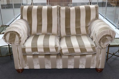 Lot 562 - A Duresta Two-Seater Sofa, modern, upholstered in cream striped velvet, with removable arm...