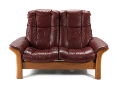 Lot 564 - An Ekornes Stressless Red Leather Reclining Sofa, modern, on square chamfered legs, 145cm by...