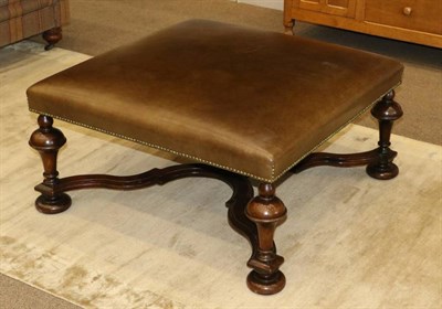 Lot 572 - A Green Close-Nailed Oversized Footstool, with tapering legs, flattened feet and a shaped...