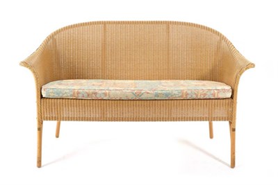 Lot 579 - A Lloyd Loom Two-Seater Basket Sofa, modern, with removable cushion, on beech legs, 147cm by...