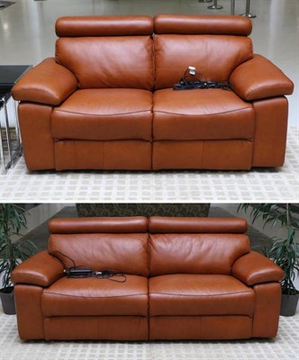 Lot 581 - A Three-Seater Brown Leather Electric Reclining Sofa, modern, 212cm by 90cm by 90cm; and A Matching