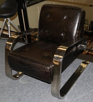 Lot 583 - A 1930s Style Polished Metal and Black Leather Armchair, modern, with buttoned back support and...