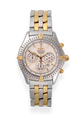 Lot 231 - A Steel and Gold Automatic Calendar Chronograph Wristwatch, signed Breitling, model: Windrider...