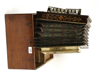 Lot 1059 - Flutina, 16 treble keys and two bass keys, makers name 'Busson Paris', in mahogany case