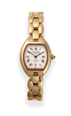 Lot 260 - A Lady's Limited Edition 18ct Gold Wristwatch, signed Cartier, model: Tortue, ref: 1945, 1997,...