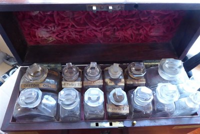 Lot 1131 - Apothecary Chest with 14 glass bottles with stoppers in top layer (most with labels) and lower...