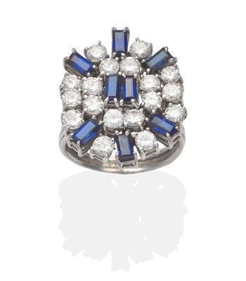 Lot 322 - A Sapphire and Diamond Cluster Ring, two baguette cut sapphires within a border of round...