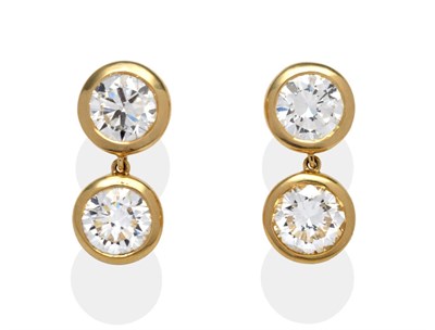 Lot 331 - A Pair of Diamond Drop Earrings, by Bulgari, a round brilliant cut diamond suspends a second...