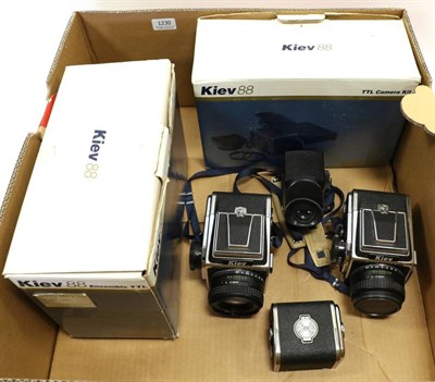 Lot 1230 - Kiev 88 TTL Camera two examples both with Assat B f2.8 80mm lenses (both boxed) with a spare...