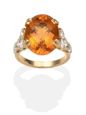 Lot 355 - A French Citrine and Diamond Ring, an oval checkerboard cut citrine in a yellow double claw...