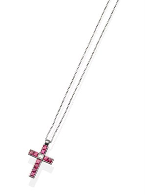 Lot 364 - A Ruby and Diamond Cross Pendant, a central princess cut diamond to calibré cut ruby set arms in