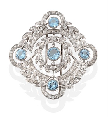 Lot 239 - A Circa 1920s Aquamarine and Diamond Brooch, grain set round cut aquamarines within a lobed diamond