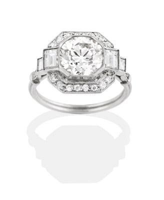 Lot 230 - An Art Deco Style Diamond Cluster Ring, an old cut diamond in a canted milgrain setting, within...