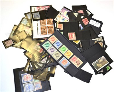 Lot 35 - GB and Commonwealth stamps on stock cards - in a small plastic tub. From QV to QE with better...