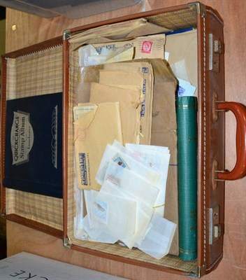 Lot 40 - Small suitcase with all world stamps including a Quickchange album. Includes mint Iran,...