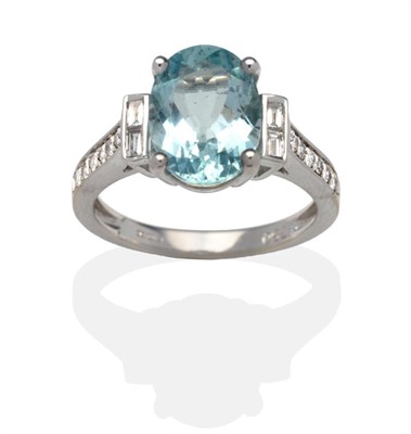 Lot 395 - An 18 Carat White Gold Aquamarine and Diamond Cluster Ring, an oval cut aquamarine in a white...