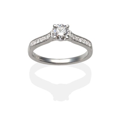 Lot 411 - An 18 Carat White Gold Diamond Solitaire Ring, a round brilliant cut diamond in a claw setting...